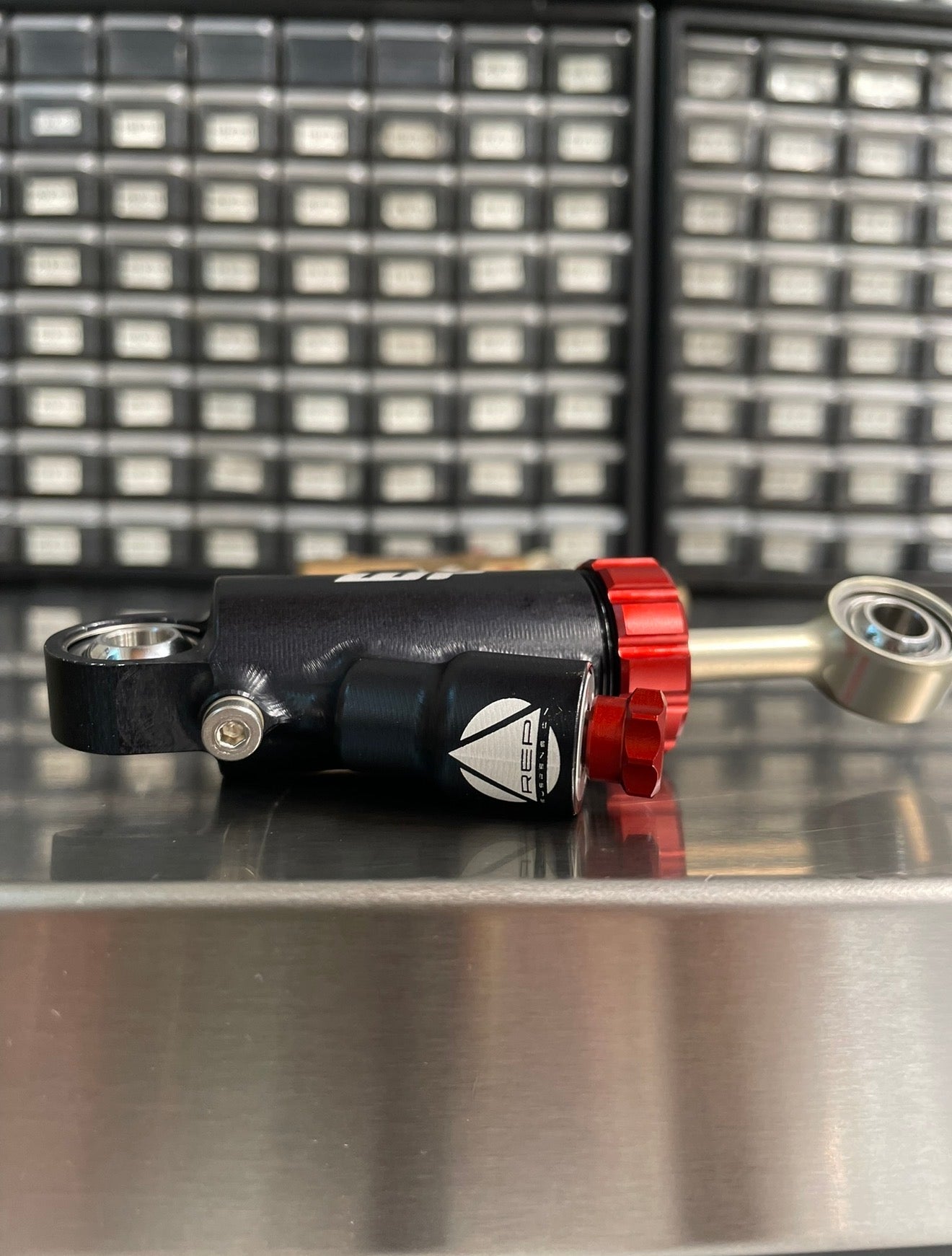 REP REVALVED- WP STEERING DAMPER WITH BRACKET